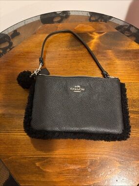 Coach Black Pebbled Leather Wristlet with Shearling Edge and Pom